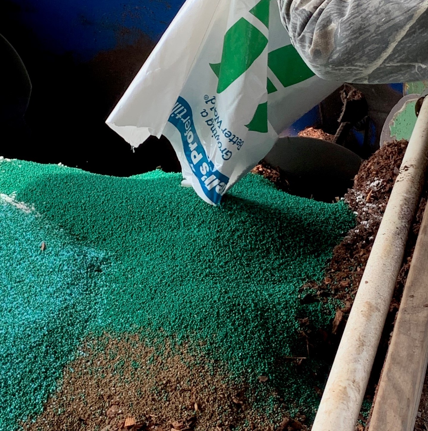 Fertilizer going into the mixer